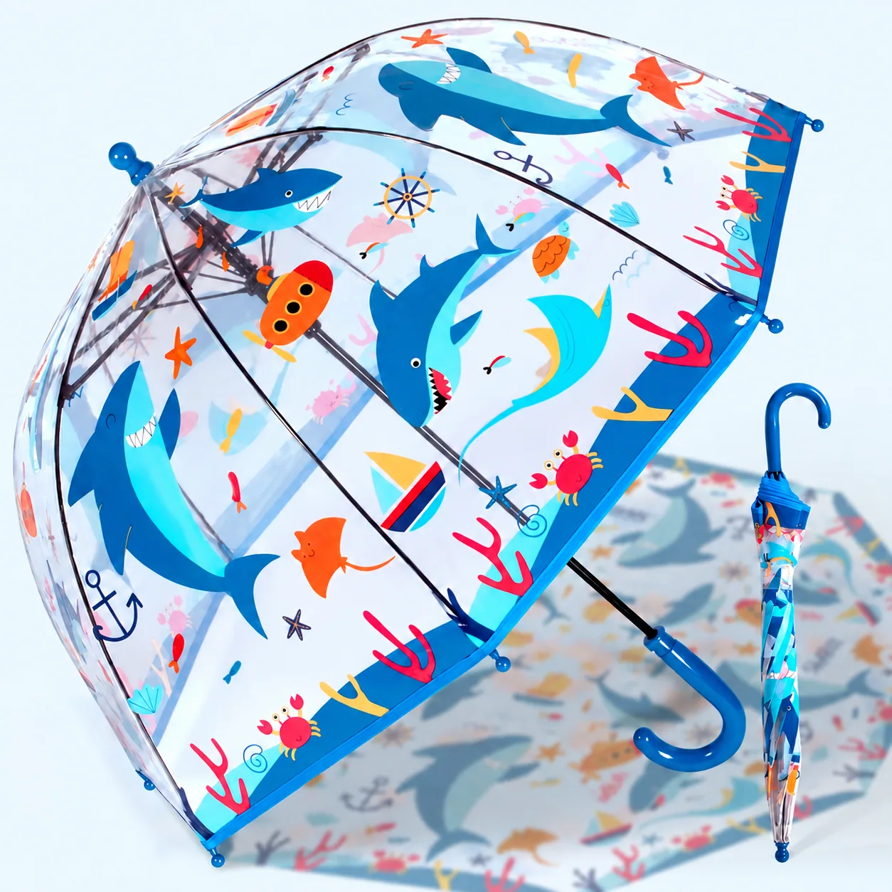 Open and closed clear shark-print umbrellas with blue curved handles