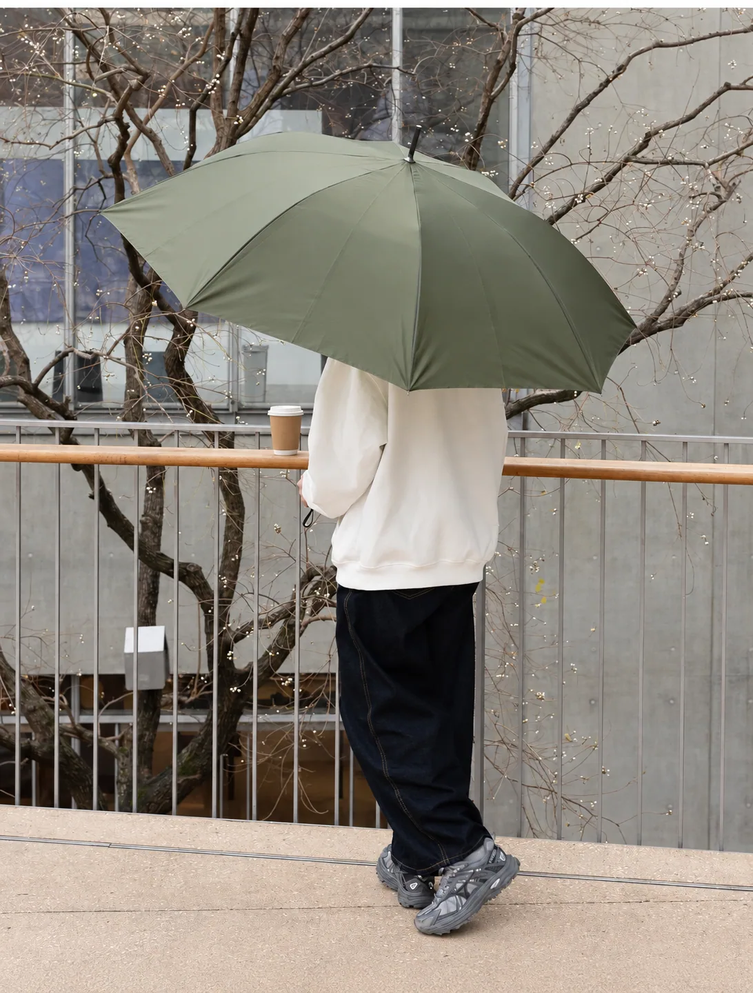 Open olive carbon-fibre umbrella