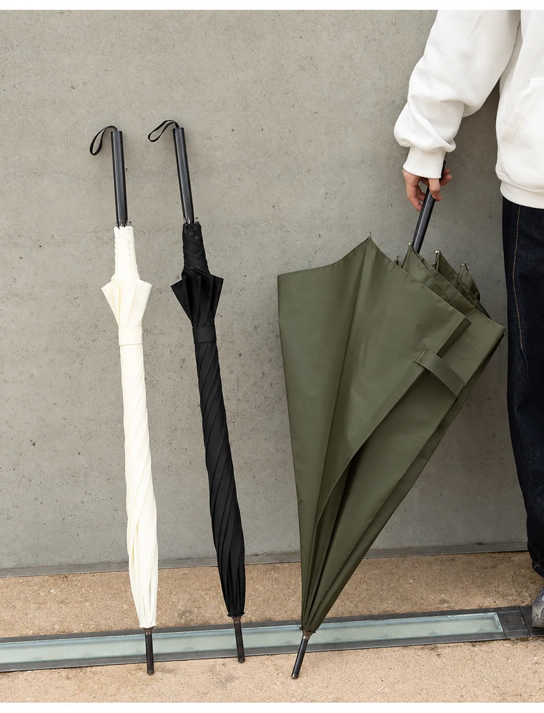 Ivory, black and olive long carbon-fibre umbrellas