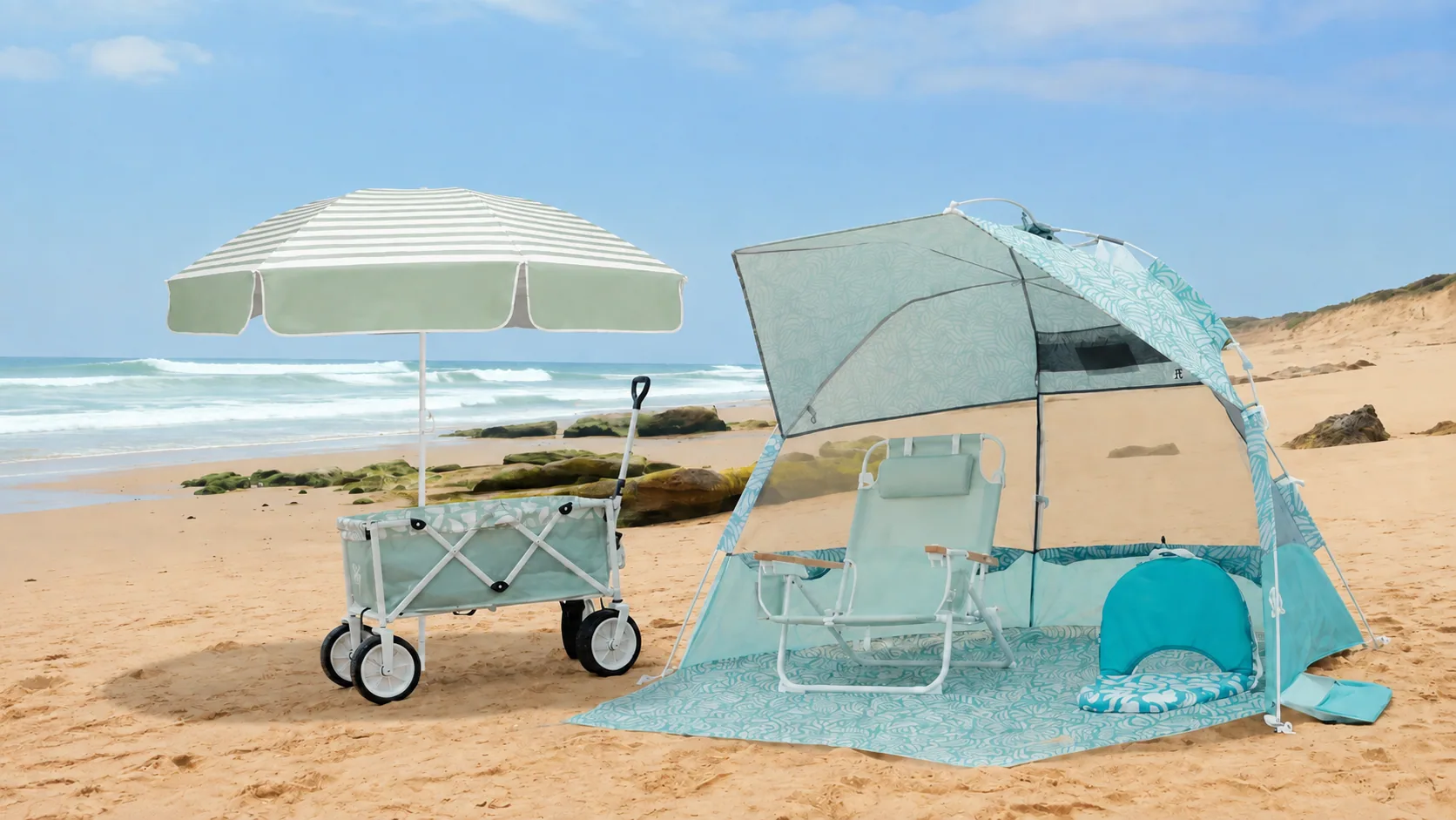 Reference-based sage striped beach umbrella with matching beach wagon, patterned tent, folding chair and beach mat on a sandy coast
